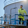 A Cerato Terminal LLC employee standing on one of their oil tanks